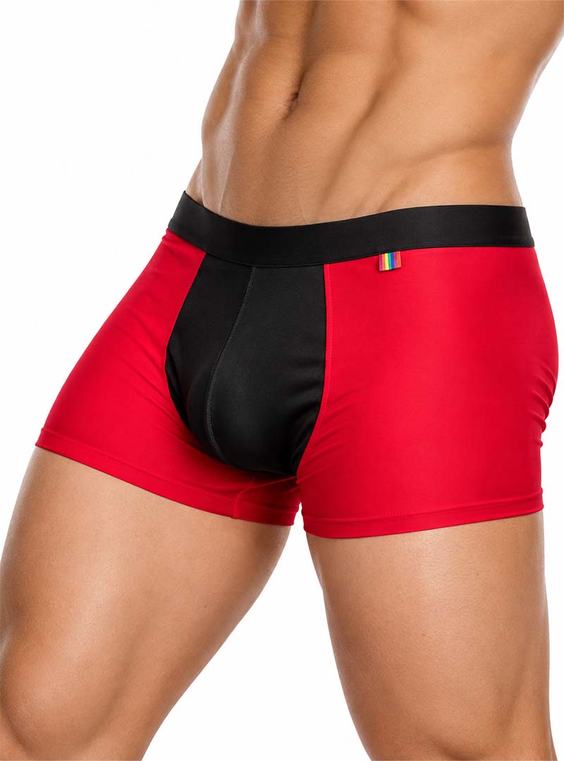 Man wearing red Pride Ultra Stretch Amplify Trunk on a white background, side view